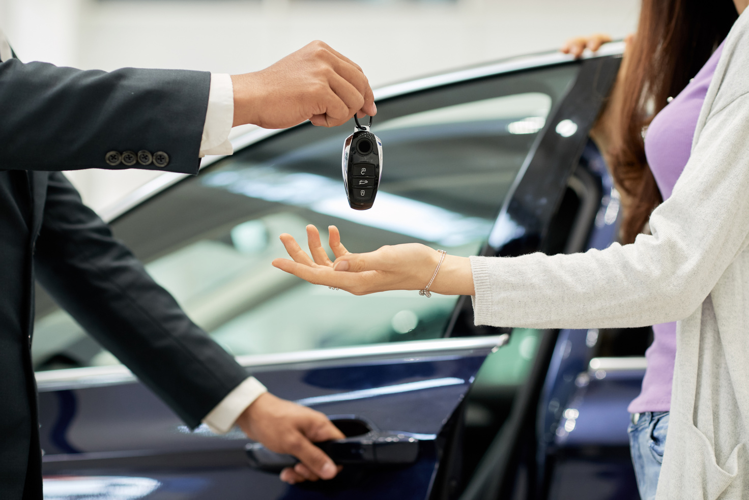 Woman Purchasing Car at the Dealership